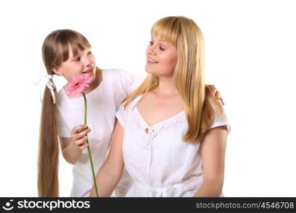 daughter giving her mother a present in studio