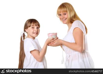 daughter giving her mother a present in studio