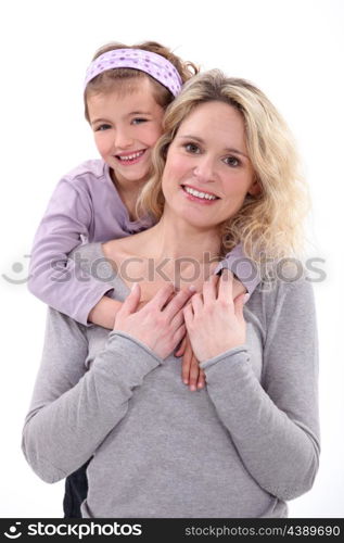 Daughter hugging her mom.