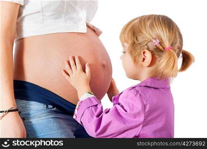 Daughter hugging mother&acute;s pregnant belly isolated on white