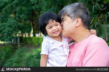 Daughter in the embrace of the father And kiss each other with love. Asia family and love concept