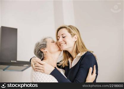 daughter kissing mom mothers day
