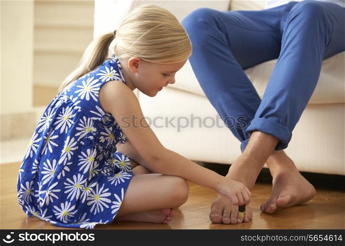 Daughter Painting Father&#39;s Toenails At Home