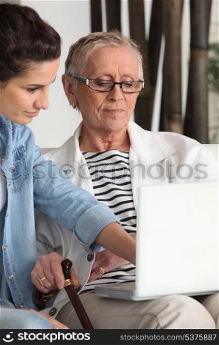 Daughter showing mother the internet