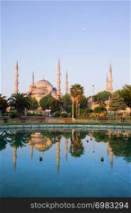 Dawn at the Blue Mosque (Sultan Ahmet Camii) with reflection on water in Sultanahmet district, city of Istanbul, Turkey.