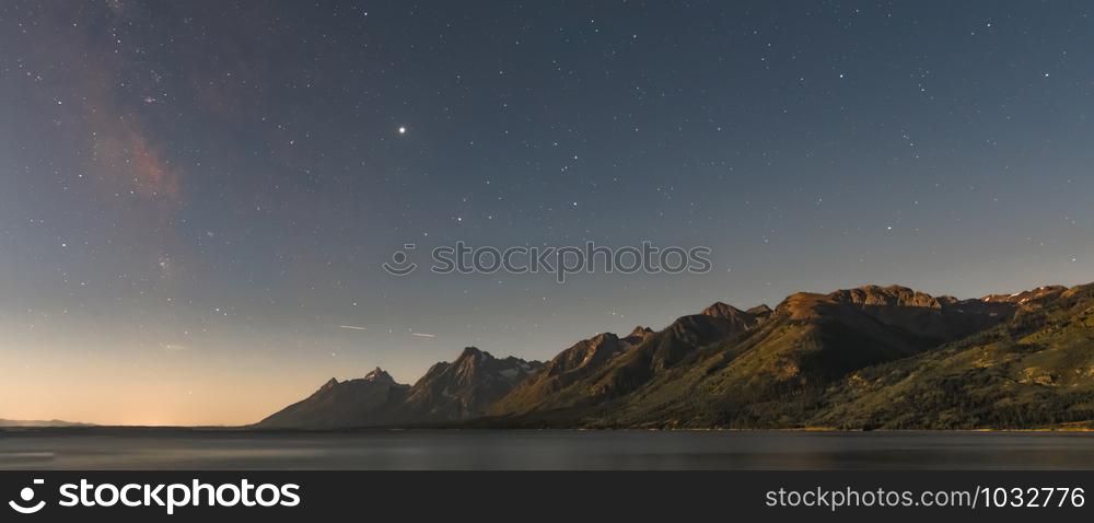 Dawn Breaks Over Starry Sky and Tetons Range