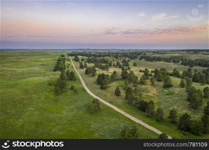 dawn over sandy road in Nebraska National Forest, aerial view