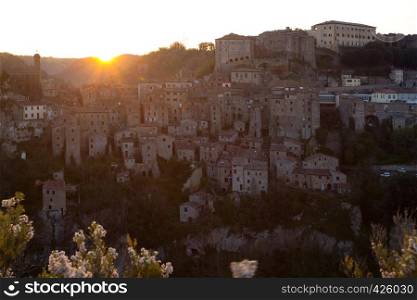 Dawn over the old famous tuff city of Sorano, province of Siena. Tuscany, Italy