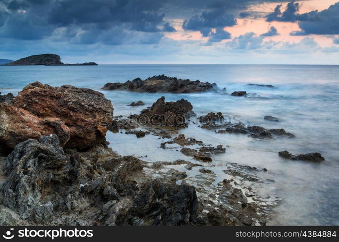 Dawn sunrise landscape over beautiful rocky coastline in Mediterranean Sea