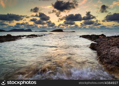 Dawn sunrise landscape over beautiful rocky coastline in Mediterranean Sea