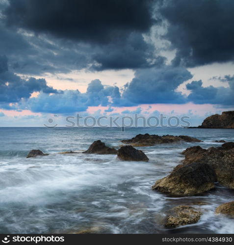 Dawn sunrise landscape over beautiful rocky coastline in Mediterranean Sea