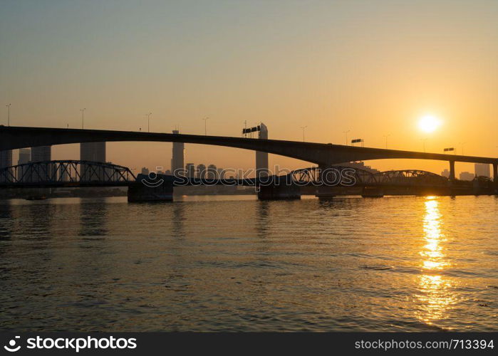 Dawn with the bridge in the morning. In the city of Bangkok on the river in the morning