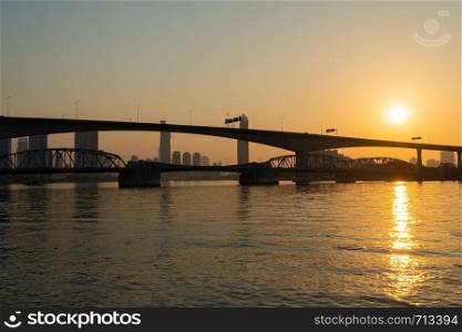 Dawn with the bridge in the morning. In the city of Bangkok on the river in the morning