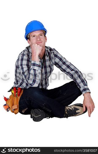 Daydreaming construction worker