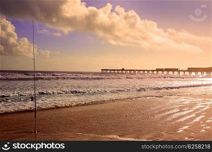 Daytona Beach in Florida shore with pier and fishing rod USA