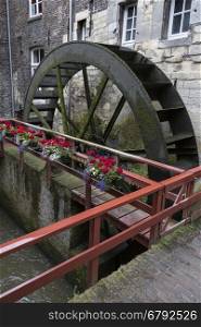 De Bisschopsmolen Waterwheel in the city of Maastricht in the southeast of the Netherlands. Maastricht is an industrial city and capital of the province of Limburg. It is situated on both sides of the River Maas near the Belgian and German borders.