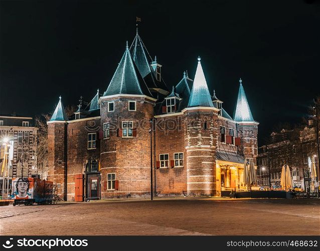 De Waag castle in night Amsterdam with no people