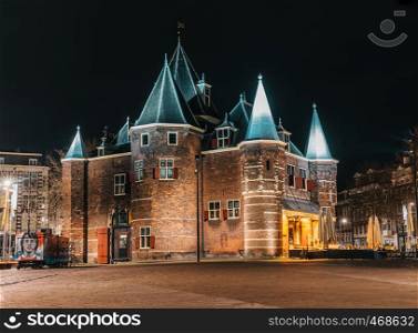 De Waag castle in night Amsterdam with no people