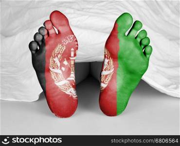 Dead body under a white sheet, flag of Afghanistan