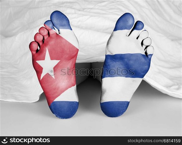 Dead body under a white sheet, flag of Cuba