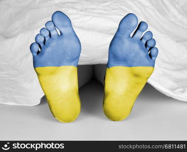 Dead body under a white sheet, flag of Ukraine