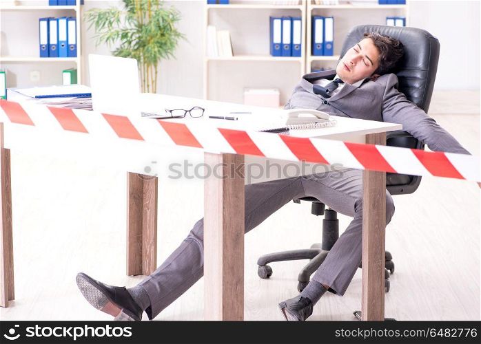 Dead businessman at this desk