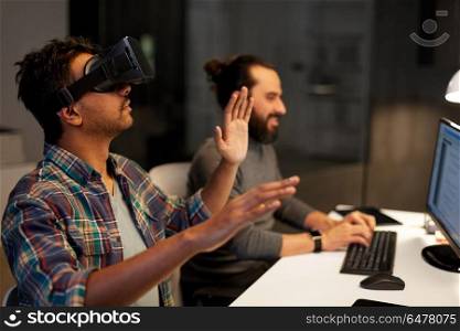 deadline, augmented reality and technology concept - creative man with virtual headset or 3d glasses at office. creative man in virtual reality headset at office. creative man in virtual reality headset at office