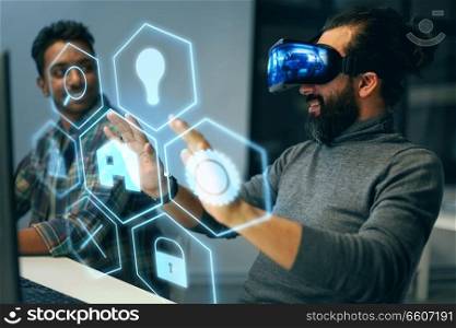 deadline, augmented reality and technology concept - creative man with virtual headset or vr glasses and hologram of menu icons at night office. man in vr headset with virtual interface at office