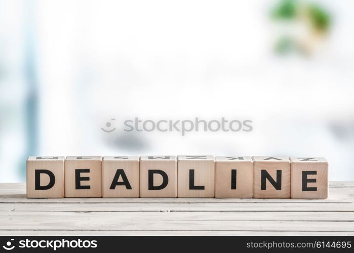 Deadline sign on a wooden table in an office