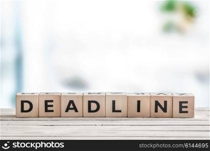 Deadline sign on a wooden table in an office
