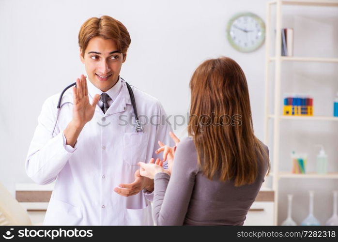 Deaf-mute female patient visiting young male doctor 