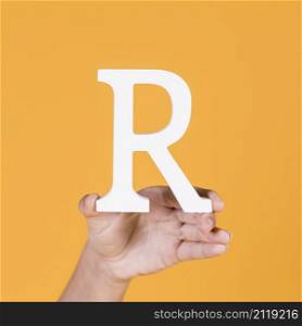 deaf woman s hand holding r alphabet