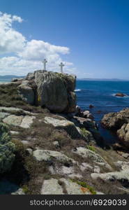 Death Coast with lighthouse and cross of dead fishermen in Galicia