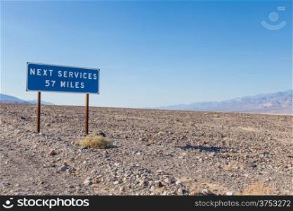 Death Valley, USA. Next service streetsight useful for travel concept