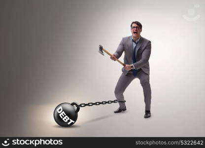 Debt concept with businessman escaping loan burden with axe