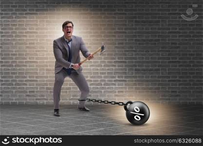 Debt concept with businessman escaping loan burden with axe
