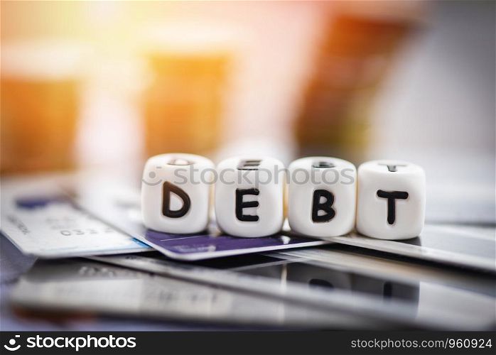 Debt credit card and money coin stack / Increased liabilities from exemption debt consolidation concept of financial crisis and problems risk business management loan interest