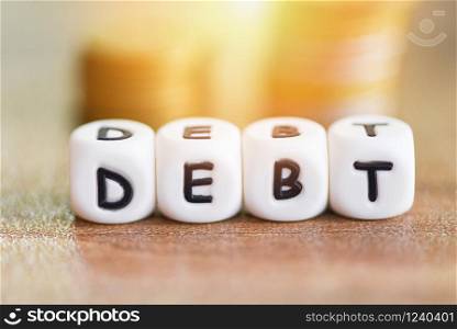 Debt dices on money coin stack staircase step up / Increased liabilities from exemption debt consolidation concept of financial crisis and problems risk business management loan interest