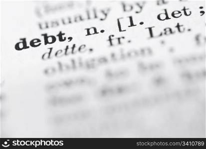Debt in English Dictionary.. Shallow DOF, focus on debt in English dictionary.