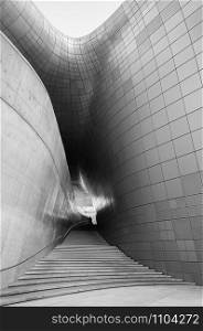 DEC 11, 2015 Seoul, South Korea - Dongdaemun design plaza or DDP modern free from building architecture in black and white with metalic entrance tunnel was designed by Zaha Hadid