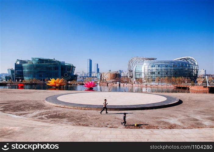 DEC 13, 2016 Seoul, South Korea - Kid and father playing at Sebitseom (Some Sevit) Floating Islands in Han river, famous Modern landmark