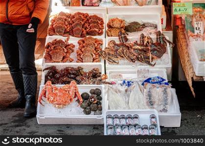 DEC 2, 2018 Hakodate, Japan - Japanese crabs seafood shop at Hakodate Asaichi fish market Hokkaido. Famous fresh seafood and street food attaction