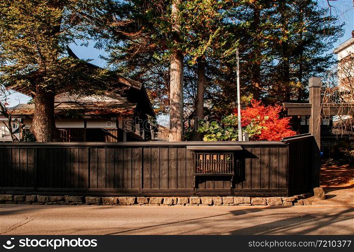 DEC 3, 2018 Kakunodate, Japan - Kakunodate old Samurai town famous vintage Edo village house fence with pine tree. Akita, Tohoku region