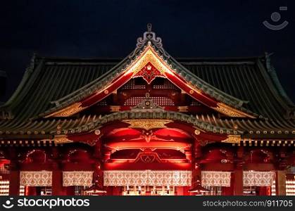 DEC 4, 2018 Tokyo, Japan - Kanda Myojin Shrine ancient main hall grow in the dark at night. Most famous shrine to pray for success