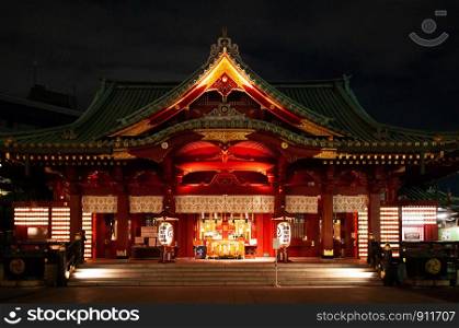 DEC 4, 2018 Tokyo, Japan - Kanda Myojin Shrine ancient main hall grow in the dark at night. Most famous shrine to pray for success