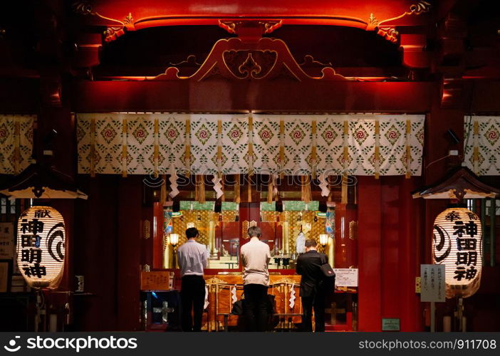 DEC 4, 2018 Tokyo, Japan - Kanda Myojin Shrine ancient main hall grow in the dark at night. Most famous shrine to pray for success