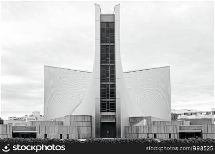 DEC 5, 2019 Tokyo, JAPAN - Tokyo St. Mary Cathedral Church modern architecture and metal roof with beautiful slope under cloudy sky. Designed by Kenzo Tange and was built in 1964.