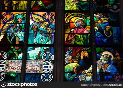 Decal window transparency inside the cathedral of St Vitus in Prague, a church with dark Gothic towers guarded by gargoyle: the main religious symbol of the Czech Republic