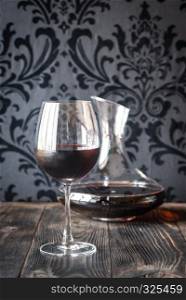 Decanter and glass with red wine