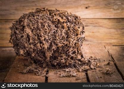 Decay brown log destruction by termite on wooden board